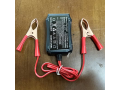 zariadnii-pristrii-dlia-telefoniv-vid-akumuliatora-z-krokodilami-8-24v-3-usb-small-0